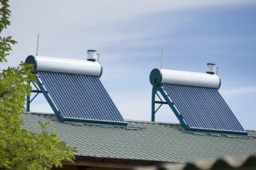 Solar Water Heaters Installed on Residential Roof © Serghei V