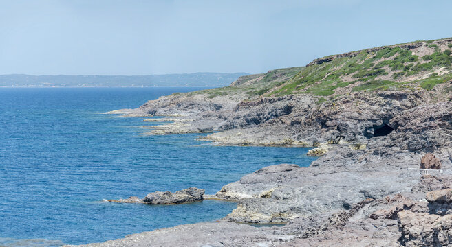 rocky shore and skerries at Cala Grotta cove, sant Antioco island,  Cagliari, Italy