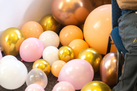 Colorful Balloon Cluster on Indoor Floor with Festive Party Decorations