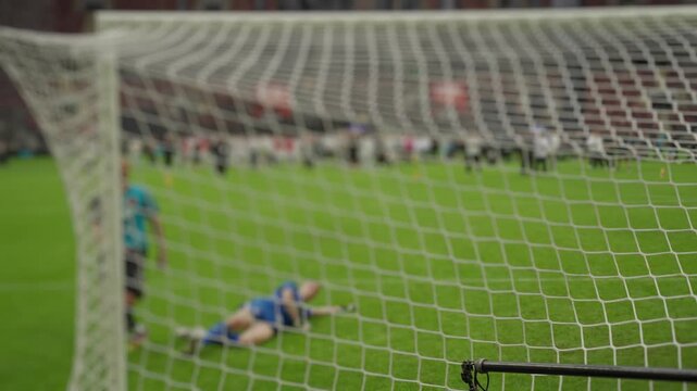 Soccer player scoring a penalty kick goal