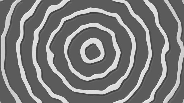 Abstract paper cutout circles with soft shadows on a clean background, creating a minimal concentric pattern animation