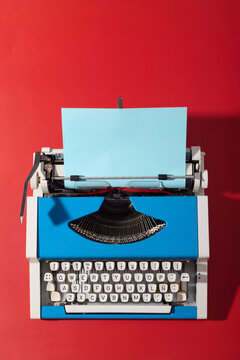 Closeup of a vintage typewriter on a red table