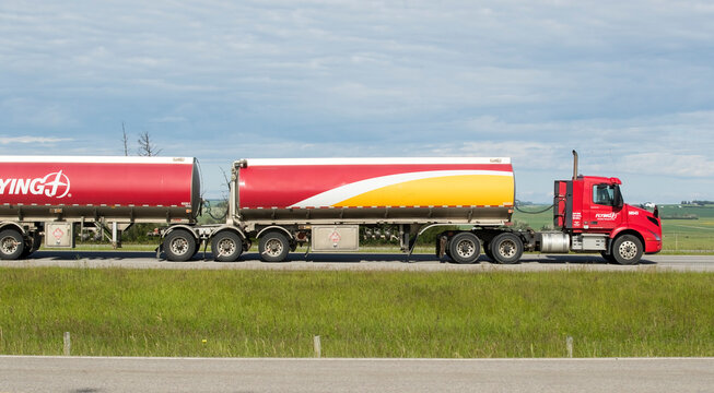 Airdrie, Alberta, Canada. July 02, 2026. A truck hauling freight along the Queen Elizabeth II Highway near Airdrie, Alberta, Canada