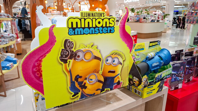 Illumination Minions and Monsters promotional cardboard standee display with movie character branding on July 3, 2026 in Bangkok, Thailand