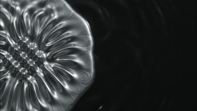 Macro of vibrating metallic liquid forming intricate resonance patterns for sound therapy