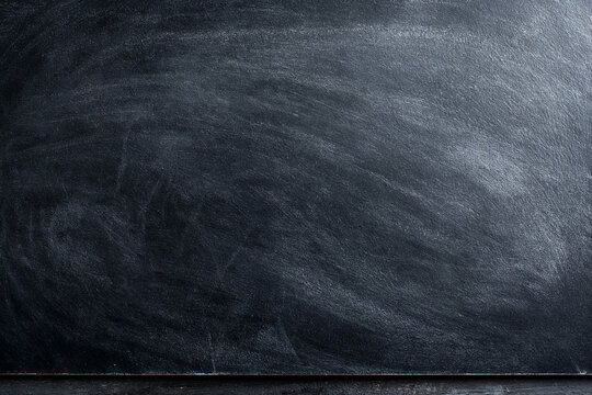 a school blackboard stained with chalk
