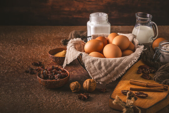 Baking ingredients and tools arranged for a rustic, homemade dessert preparation