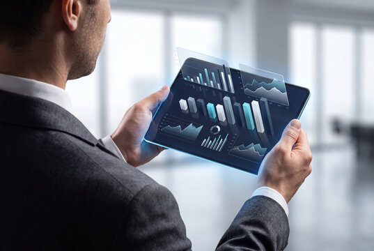 Business Executive Holding Digital Financial Analytics Dashboard