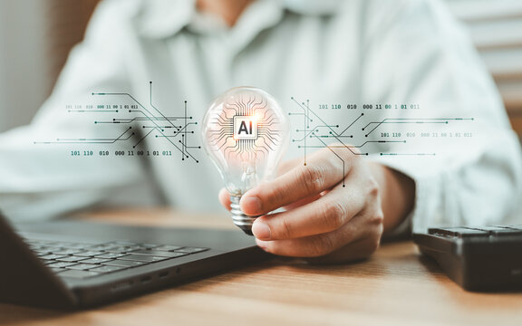 Businessperson holding light bulb with AI microchip and digital circuit interface. Advanced artificial intelligence processor technology for smart innovations and computing power