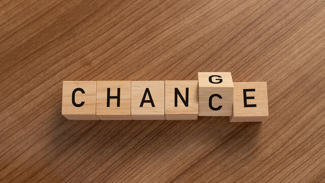 Wooden blocks turning the word CHANCE into CHANGE on a desk. A conceptual image representing personal growth, business transformation, strategy, and embracing new opportunities