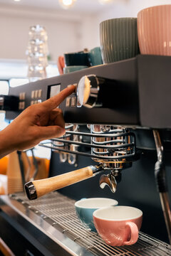 Barista using coffee machine 