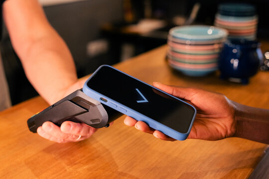 Paying With Smartphone at a Cafe 