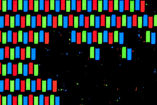 Microscopic view of damaged LCD screen with RGB subpixels