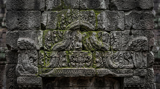 Ancient Moss Covered Temple Stone Carving Relief with Intricate Historic Architecture