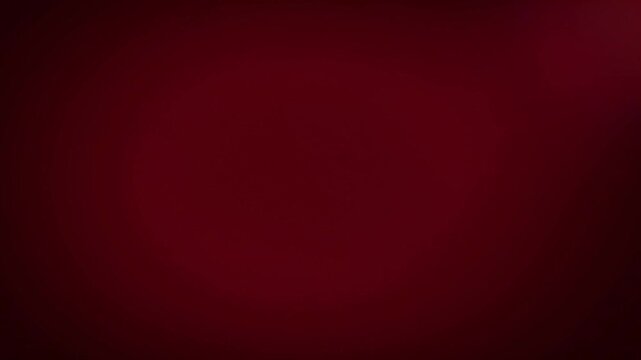 Smooth abstract motion of a dark red gradient background transitioning to deep black, perfect for