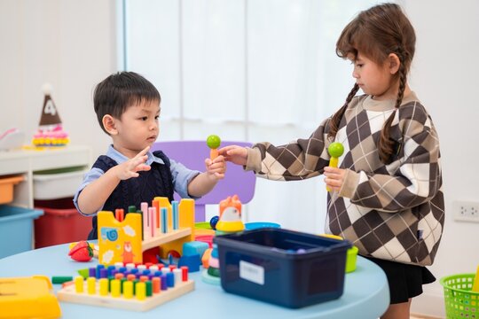 Kids play with colorful toys and engage in activities at a learning center in daytime