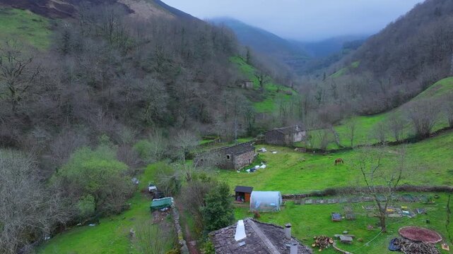 Aerial view from a drone of the winter landscape around the village of Vega de Pas. Pasiegos Valleys region, Cantabria, Spain, Europe