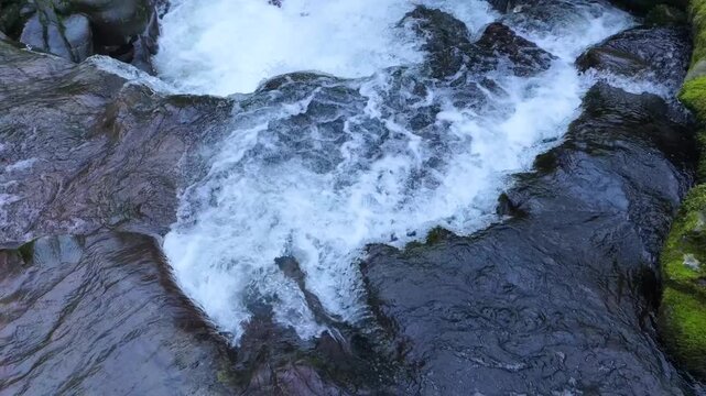 Aerial view from a drone of the waterfall landscape around the village of Vega de Pas. Pasiegos Valleys region, Cantabria, Spain, Europe