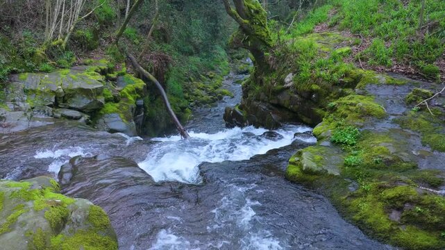 Aerial view from a drone of the waterfall landscape around the village of Vega de Pas. Pasiegos Valleys region, Cantabria, Spain, Europe