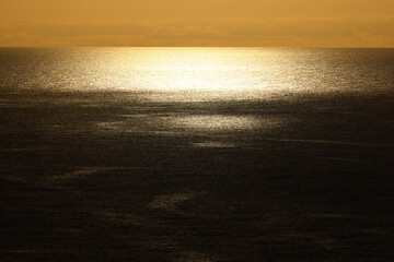 Golden sunset reflection shimmering across the Atlantic Ocean © Gabriela
