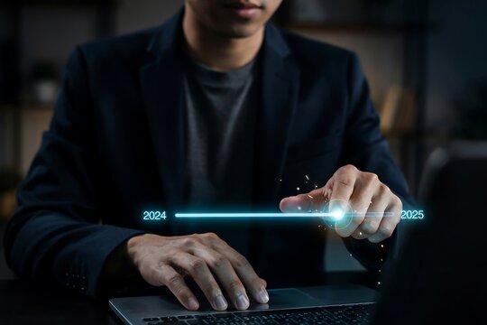 Businessman using laptop to plan business strategy for the transition from 2024 to 2025 year