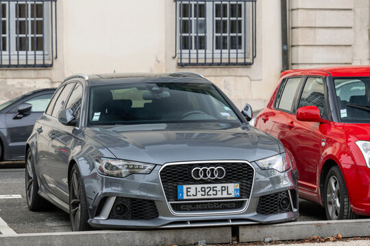 Nancy, France - October 8th 2020 : View on a grey Audi RS6 Avant C7 parked on a street between cars.