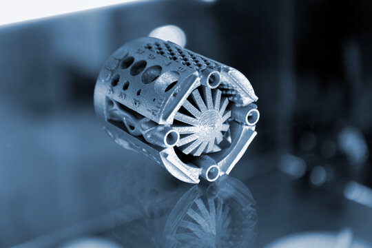 Small object printed on 3D printer. Detailed model printed on 3D printer from metal powder. Selective Laser Melting technologies. SLM. Additive modern manufacturing technology. 3D printing technology