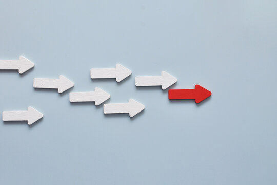 Leading red arrow representing leadership competitive advantage and success