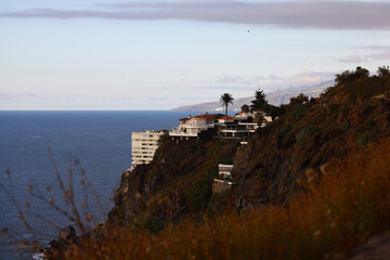 Luxury homes on volcanic cliffs overlooking the Atlantic Ocean in Tenerife © Gabriela