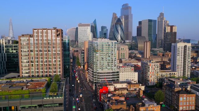 Aerial Video Over Whitechapel Road to City of London Skyline at Sunrise