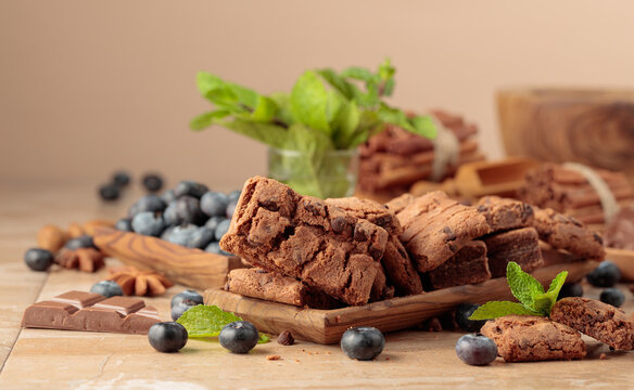 Brownie with fresh blueberries and mint.