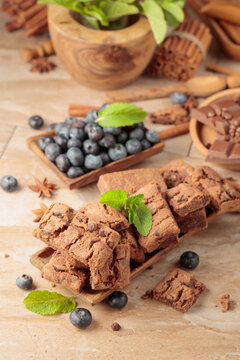 Brownie with fresh blueberries and mint.