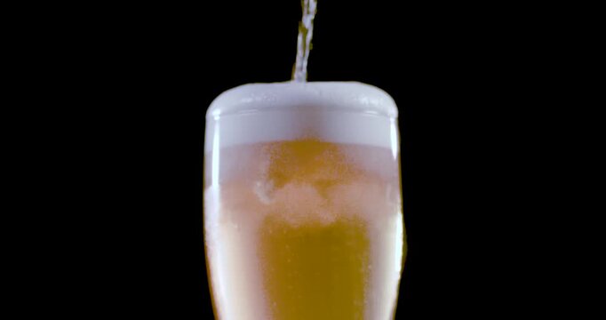 Beer pour slow motion rack focus with head spillover
