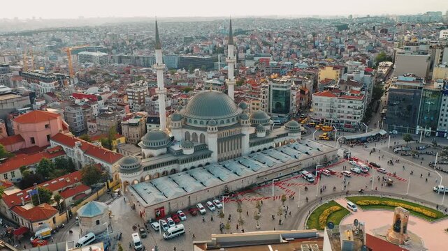 Istanbul Taksim Square and mosque aerial drone shot. Panoramic view of iconic central plaza, modern Islamic architecture and Beyoglu cityscape.