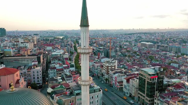 Istanbul Taksim Mosque aerial drone shot. Panoramic view of modern Islamic architecture landmark in Beyoglu district, Taksim Square and cityscape.