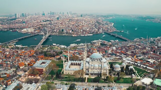 Suleymaniye Mosque aerial drone shot with Istanbul Bosphorus and Golden Horn. Panoramic view of historic landmark and scenic city landscape in Istanbul.