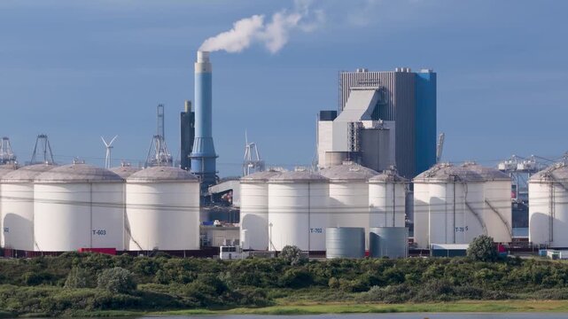 Aerial drone view of industrial oil and fuel storage tanks. Large containers and facility infrastructure for petroleum products and energy resource reserve.