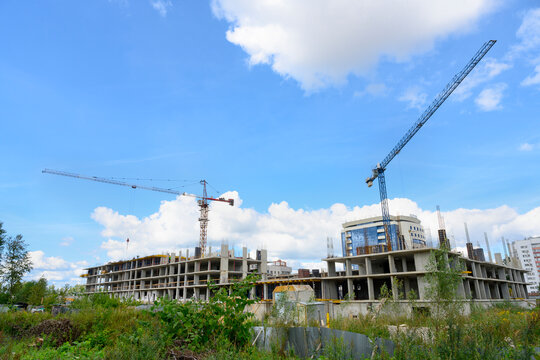 View of the construction of a multi-storey building with cranes in Yaroslavl, Russia