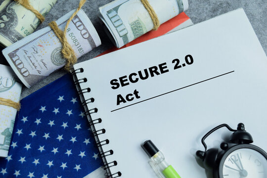 Concept of secure act 2.0 retirement reform write on book isolated on Wooden Table. For financial planning and pension savings