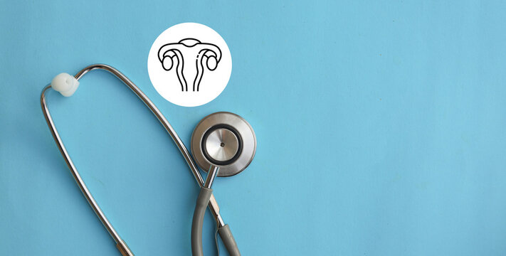 close up stethoscope with uterus symbol on blue background represent about women health checkup and lifestyle for health and wellness concept
