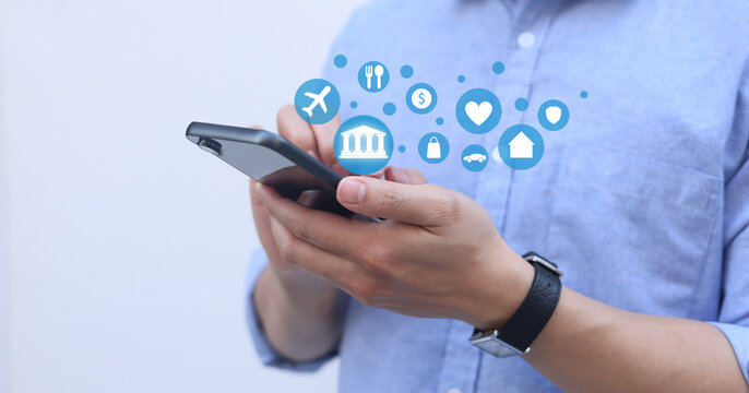 man hand hold smartphone and use function of mobile banking application for financial convenience and cashless lifestyle concept