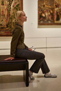 Caucasian woman looking at exhibition