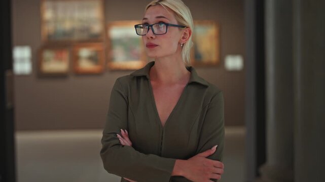 Caucasian woman looking at exhibition