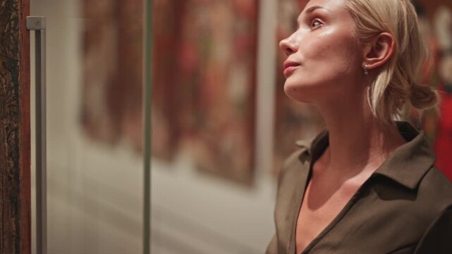 Caucasian woman looking at exhibition