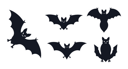 Fototapeta premium Five black silhouettes of bats and an owl in flight and perched.