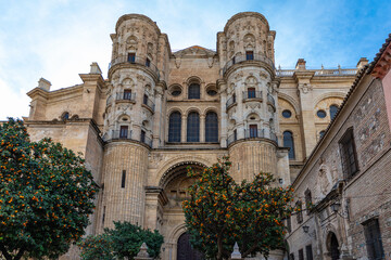 Naklejka premium View at the Malaga Cathedral or Santa Iglesia Catedral Basílica de la Encarnación, an iconic national landmark ,16th-century baroque facade