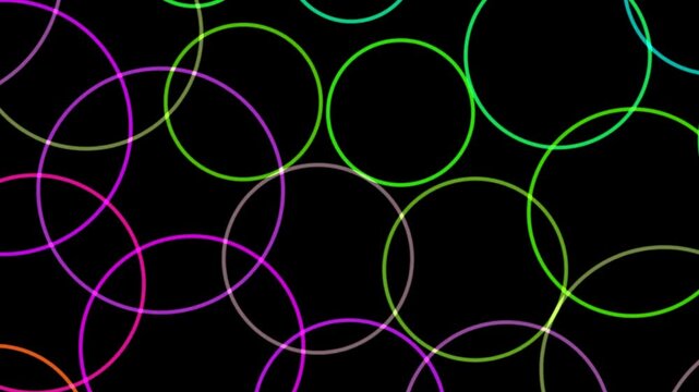 Colorful circles on a black background create a vibrant pattern with overlapping designs