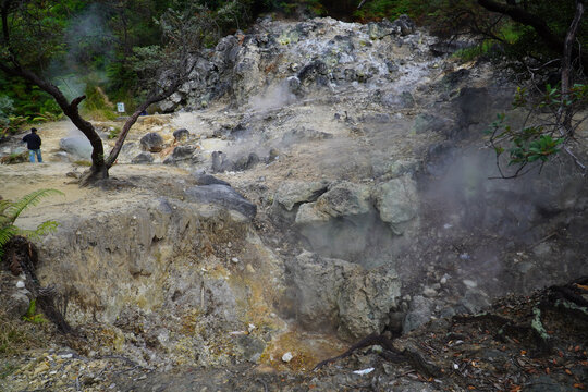 Bandung, Indonesia - July 4, 2026: Steam rises from the geothermal vents at Rengganis Crater in Ciwidey, Bandung, West Java, Indonesia. The volcanic tourist attraction is known for its natural hot spr