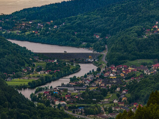 Elevated telephoto view of the Porabka Dam connecting Jezioro Miedzybrodzkie and Jezioro Czanieckie, surrounded by forests and villages, photographed from Gora Zar in southern Poland on August 15, 202 © Dorota
