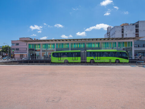 Guatemala, Guatemala City, Guatemala City - July 16, 2025. View of a public bus station. Public bus system called Transmetro. Wide shot